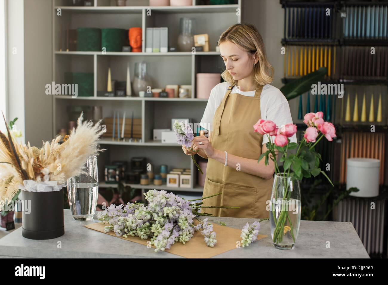 Woman making flower arrangements hi-res stock photography and images - Alamy
