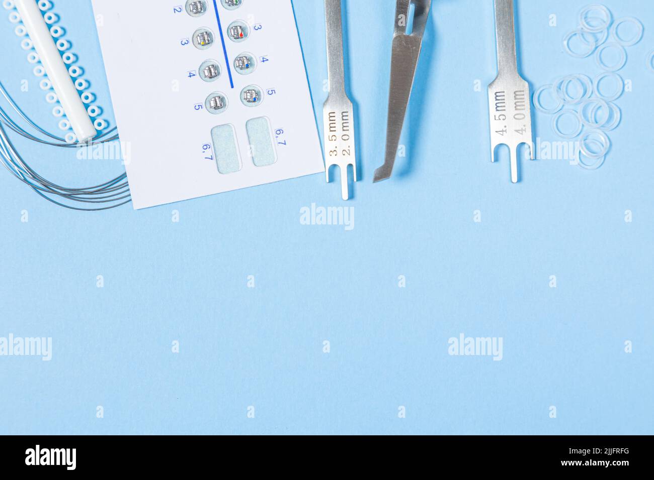 a set of special tools for an orthodontist to install braces for a patient. Orthodontic arcs