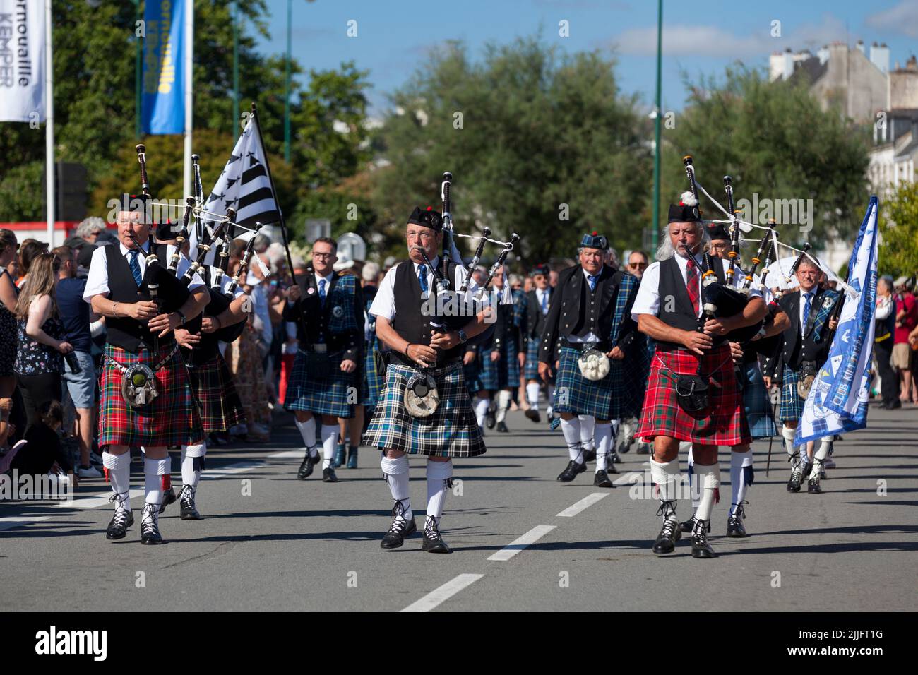 Quimper, France - July 24 2022: Musicians of the Club kilt du Pays de Lorient performing during the Cornouaille festival. Stock Photo