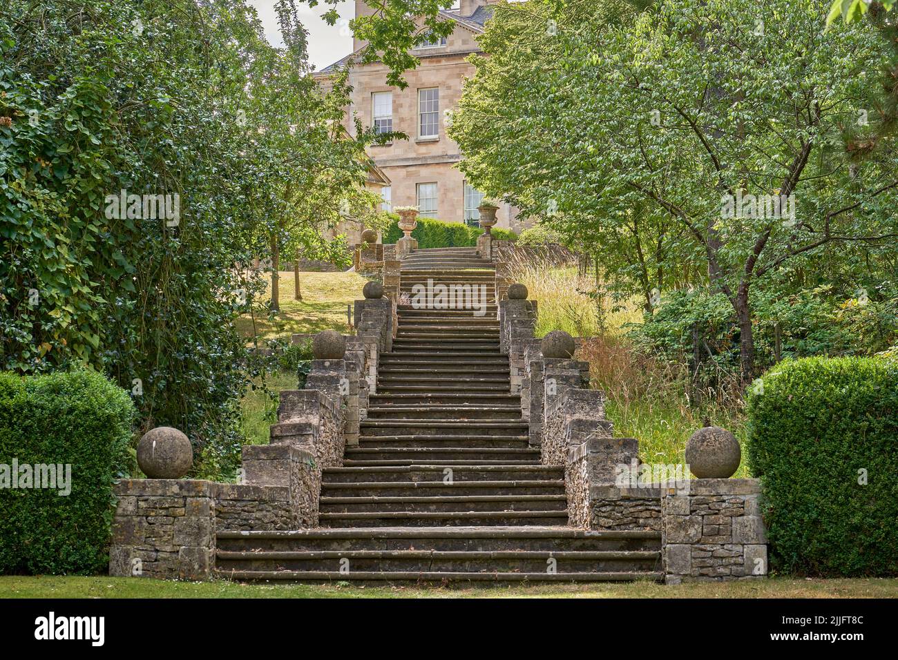 Stone garden steps leading up to a stately home Stock Photo