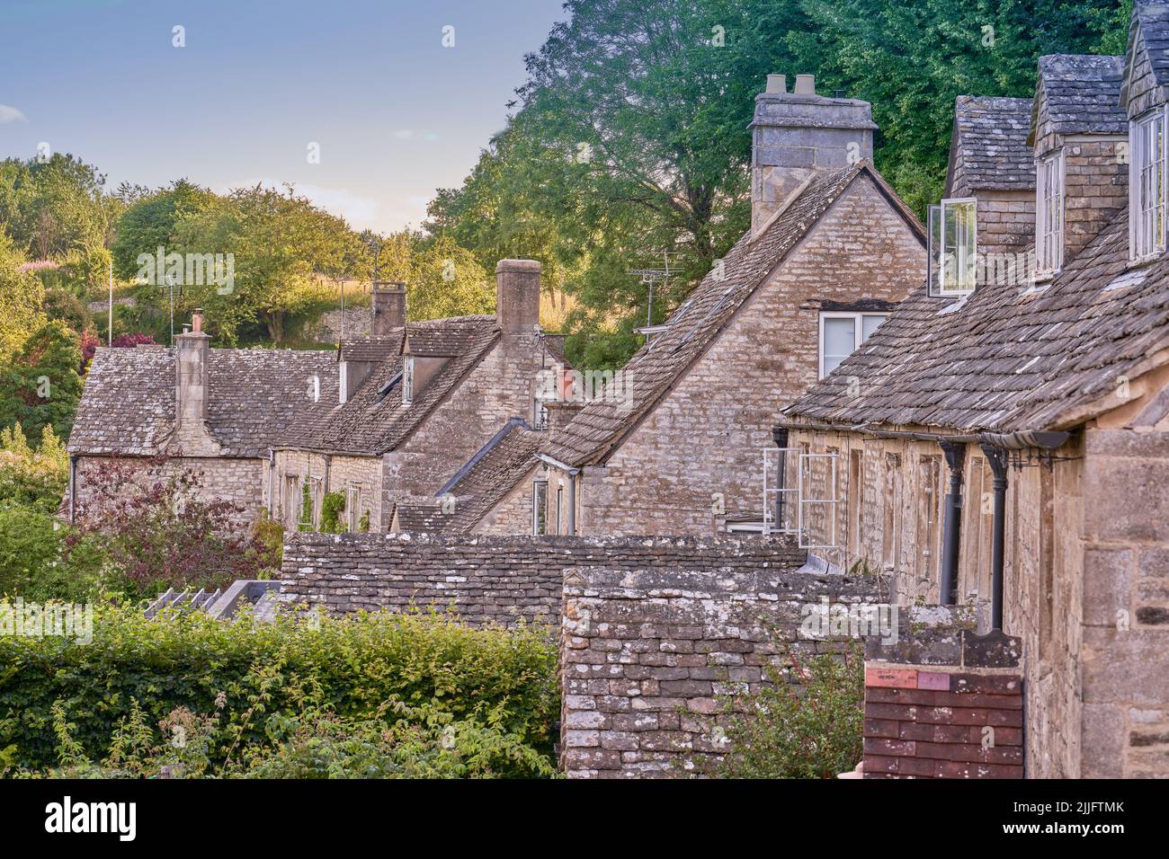 Traditional stone clad roofs on Cotswold cottages in Bisley Stock Photo