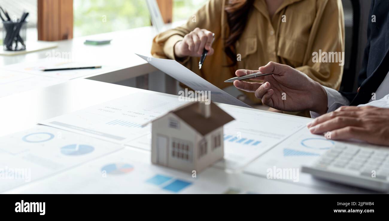 Couple calculating financial chart for investment to buying property. business real estate concept. Stock Photo