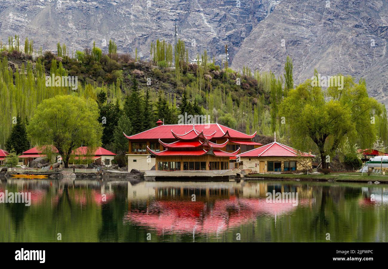 The Asian red-roof buildings on the shore of Upper Kachura Lake in Skardu, Pakistan Stock Photo
