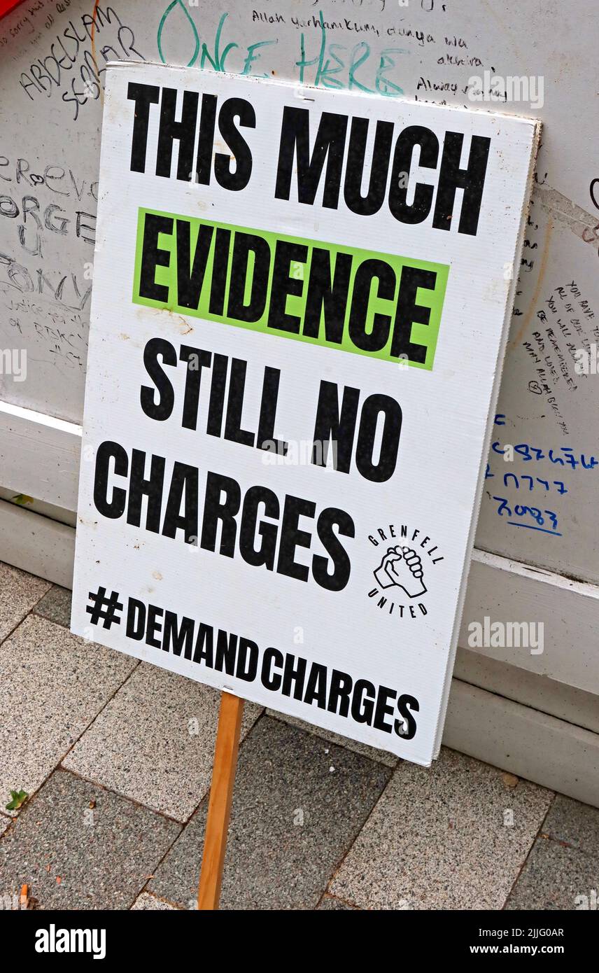 Grenfell Tower Fire demonstration placard - This much evidence,still no charges , #DemandCharges Stock Photo