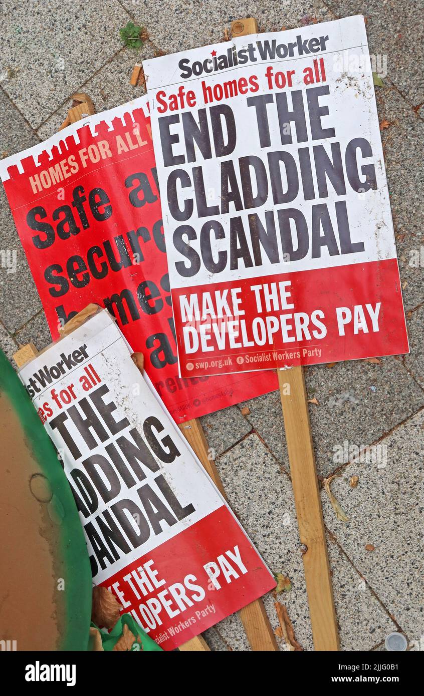 Socialist Worker placards,Safe Homes For All,End The Cladding Scandal,Make The Developers Pay,Grenfell Tower Fire Stock Photo