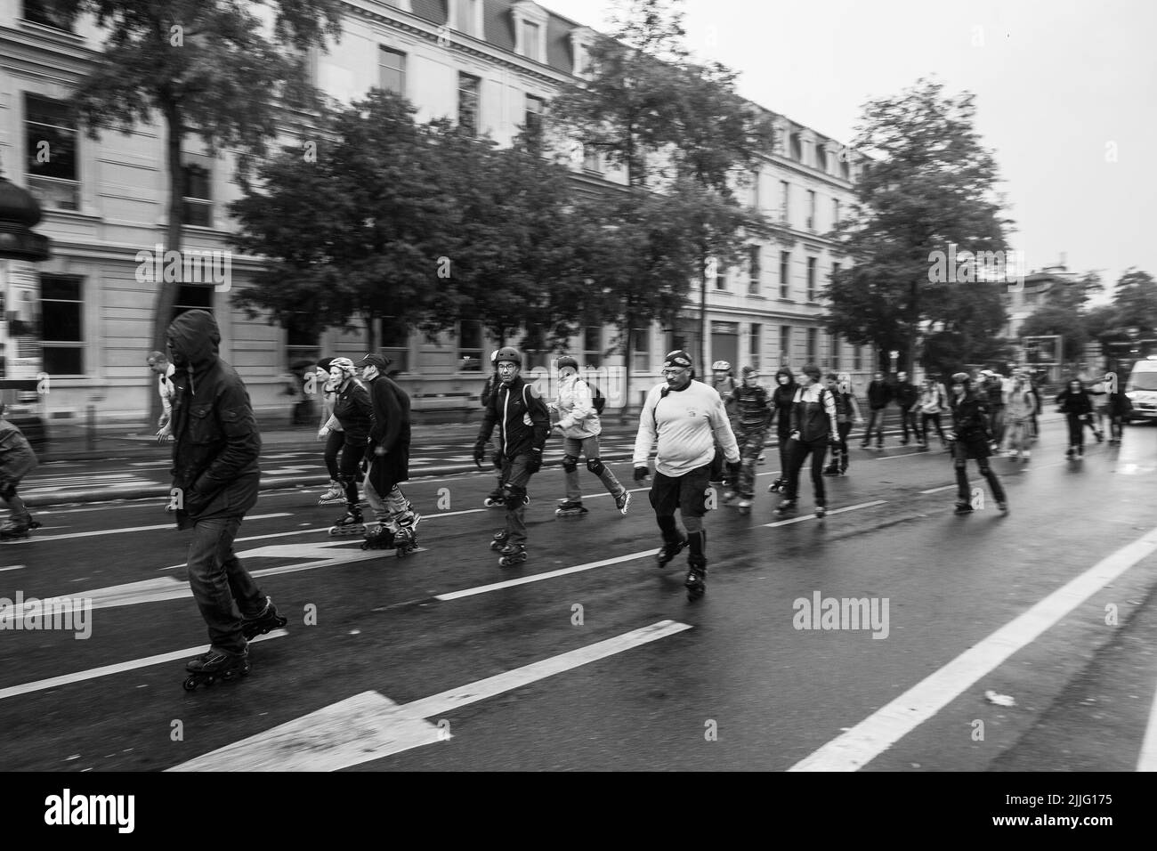 Different people old and young roller skating in Paris (left bank
