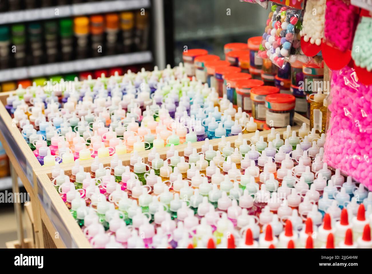 glue and paints near push pins in stationery store Stock Photo Alamy
