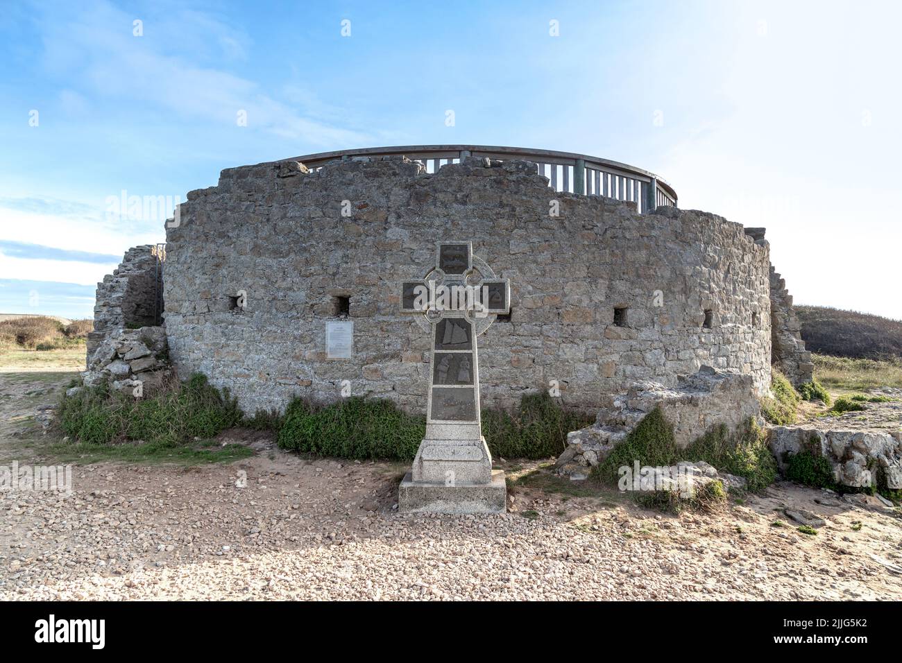 FRANCE - SEPTEMBER 6, 2019: This is an ancient Celtic cross near the remains of an old medieval tower on Pointe du Raz. Stock Photo