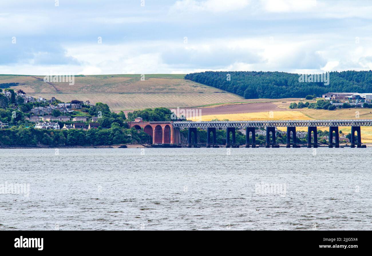 Dundee, Tayside, Scotland, UK. 26th July, 2022. UK Weather: Patchy cloud and scattered showers with some sunny spells in North East Scotland, with temperatures reaching 16°C. From the Dundee waterfront promenade, a landscape view of Newport-On-Tay and Wormit, two small towns in north east Fife, Scotland. Credit: Dundee Photographics/Alamy Live News Stock Photo