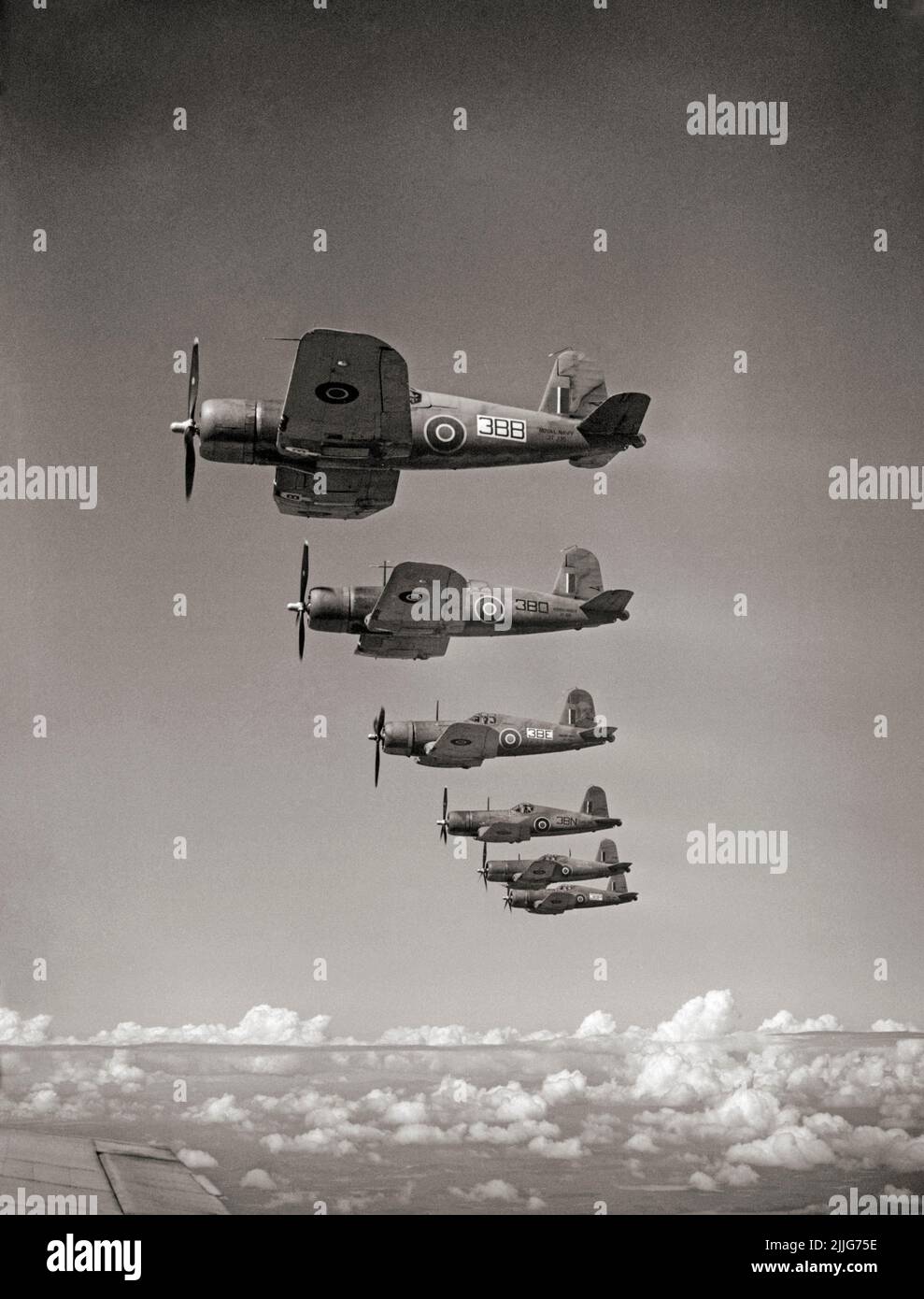 Formation photograph of six British Naval Airmen flying American built Chance-Vought Corsairs, with British markings during training. The Vought F4U Corsair was an American fighter aircraft was designed and operated as one of the most capable carrier-based fighter-bombers that saw service primarily in World War II and the Korean War. Stock Photo