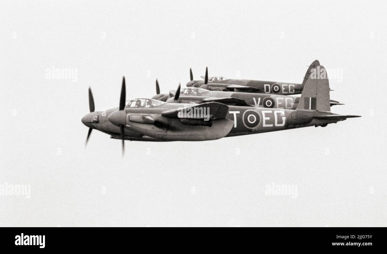 Three De Havilland Mosquito FB Mark VI Series 2s of No. 487 Squadron RNZAF based at Hunsdon, Hertfordshire, flying in tight starboard echelon formation, with 500-lb MC bombs on fitted on underwing carriers. The 'Wooden Wonder' or 'Mossie' was a British twin-engined, shoulder-winged, multirole combat aircraft, introduced during the Second World War. Unusual in that its frame was constructed mostly of wood. Stock Photo
