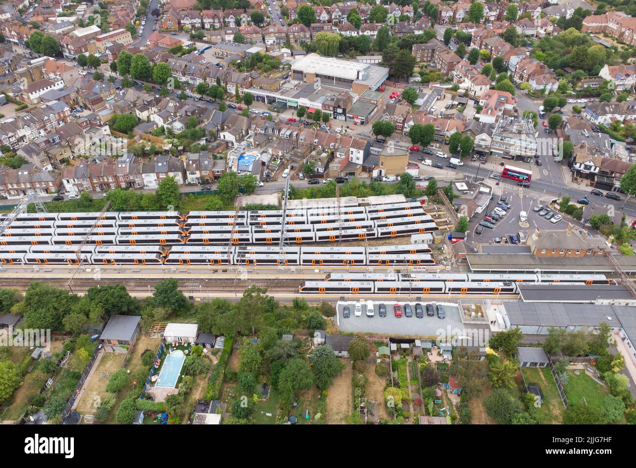 Aerial view of London Overground trains at Chingford Station. Side view of trains in the station. London Stock Photo