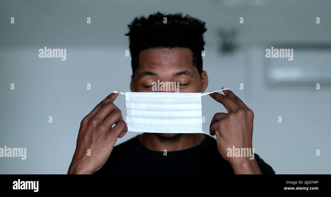 Young black African man wearing surgical face mask Stock Photo - Alamy