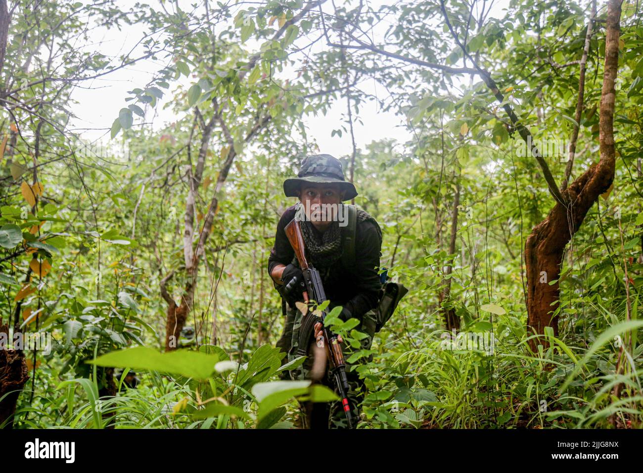 A Karenni Nationalities Defence Force (KNDF) soldier is charging ...