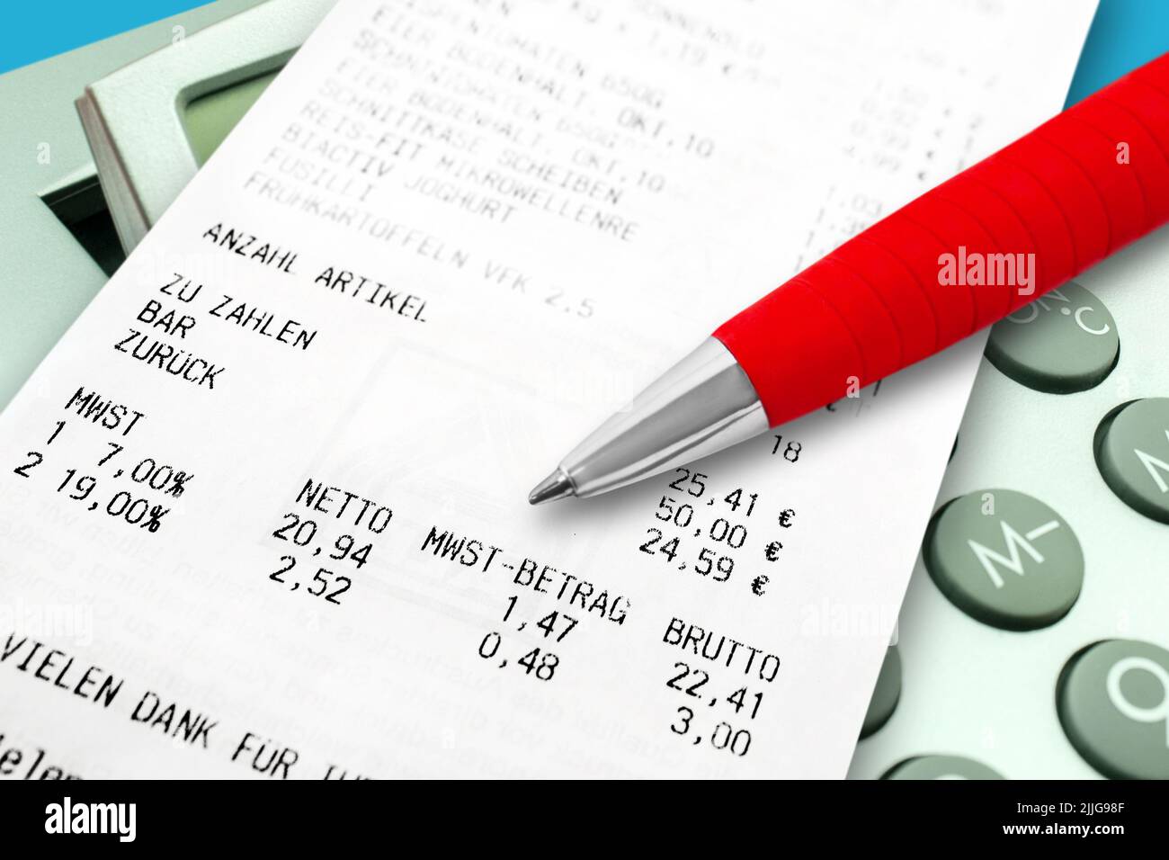 German food purchase voucher with value-added tax and calculator with red pen Stock Photo