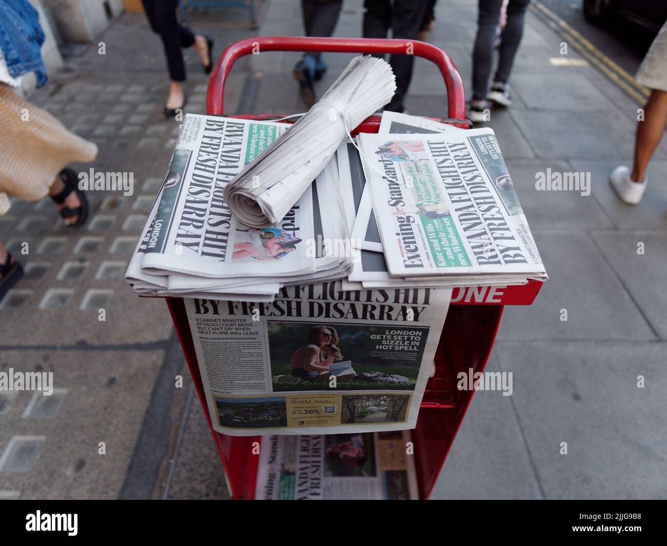 London, Greater London, England, June 15 2022: Free newspapers on a news stand in Piccadilly. Stock Photo