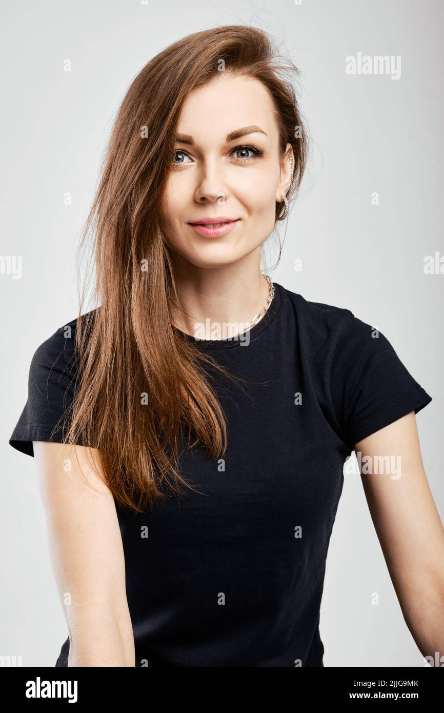 Portrait of beautiful young woman with no makeup looking at camera ...
