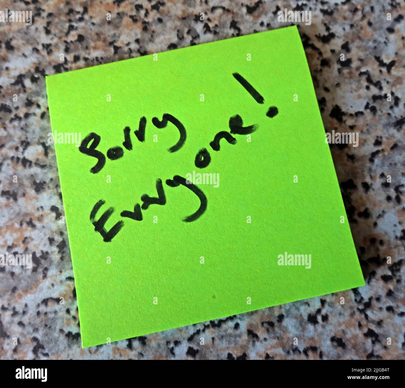 Green Post-it, with words 'Sorry Everyone' written on them Stock Photo