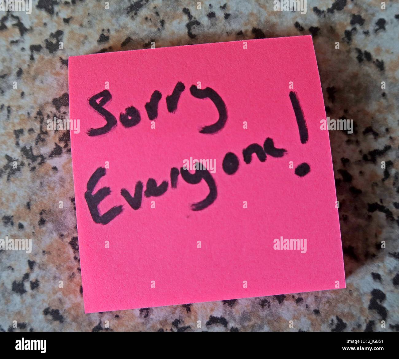 Pink Post-it, with words 'Sorry Everyone' written on them Stock Photo