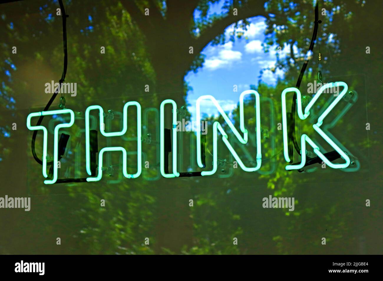 Think green neon electric sign Stock Photo