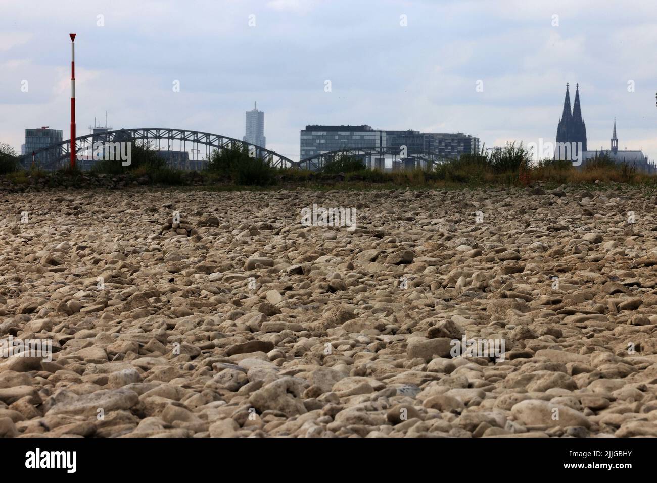 Cologne, Germany. 26th July, 2022. Pebbles lie along the Rhine on the