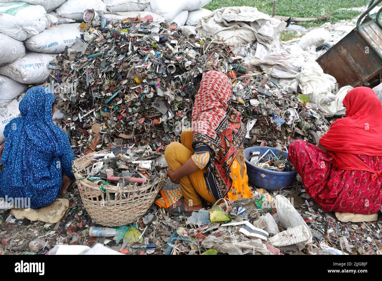 Dhaka, Bangladesh June 04, 2022 Bangladeshi women workers sorting plastic materials for