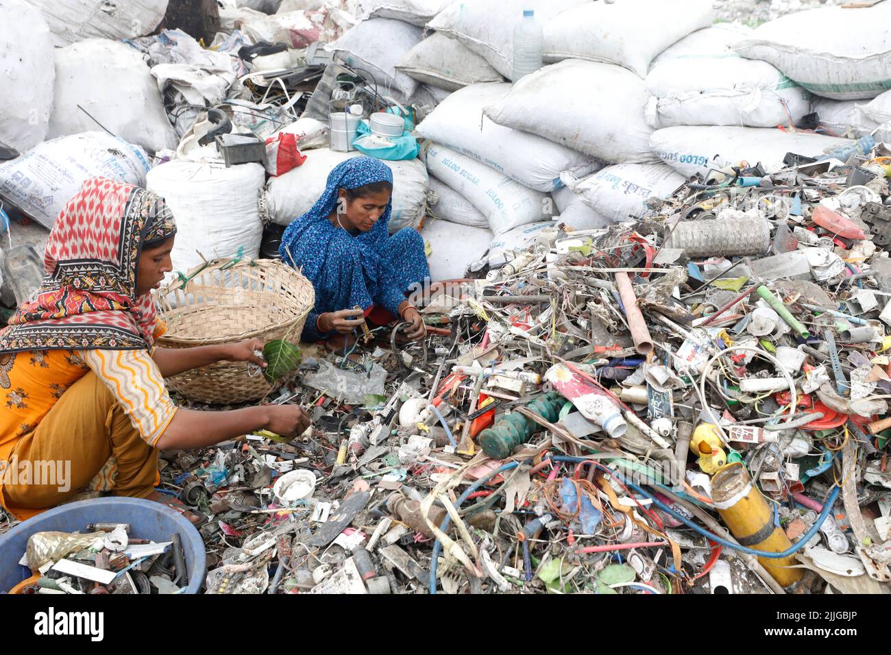Dhaka, Bangladesh June 04, 2022 Bangladeshi women workers sorting plastic materials for