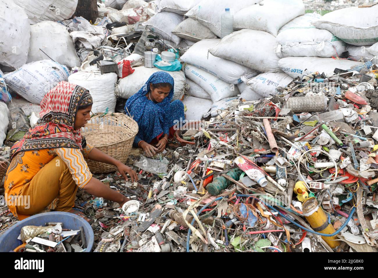 Dhaka, Bangladesh June 04, 2022 Bangladeshi women workers sorting plastic materials for