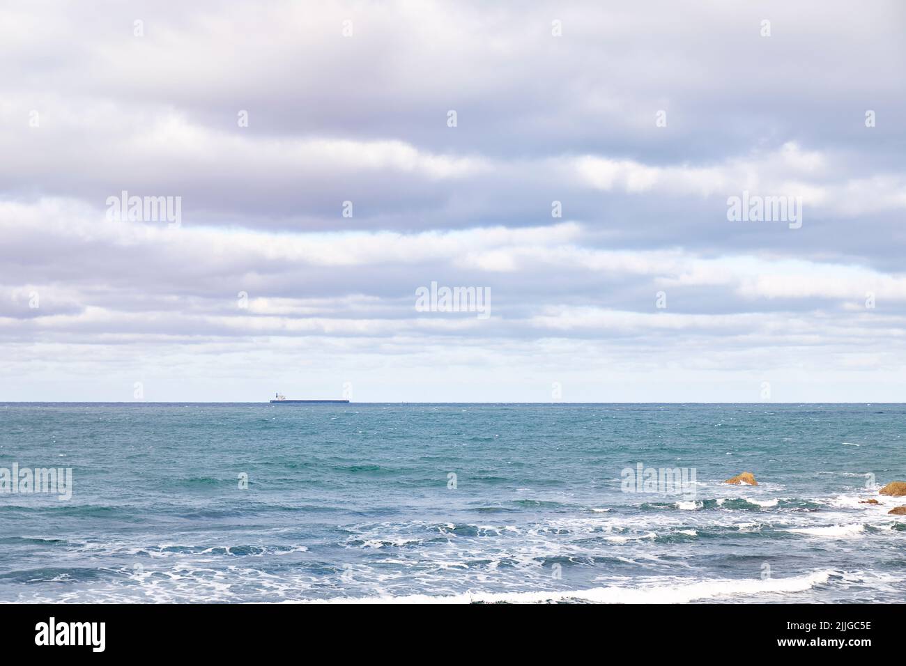 Views on the horizon of a cargo ship sailing. Oil and gas transport concept Stock Photo