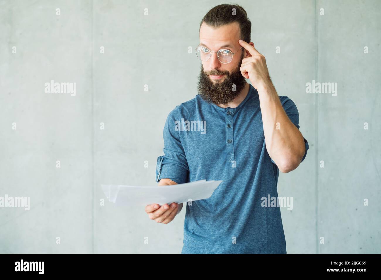 legal contract smart man document finger temple Stock Photo