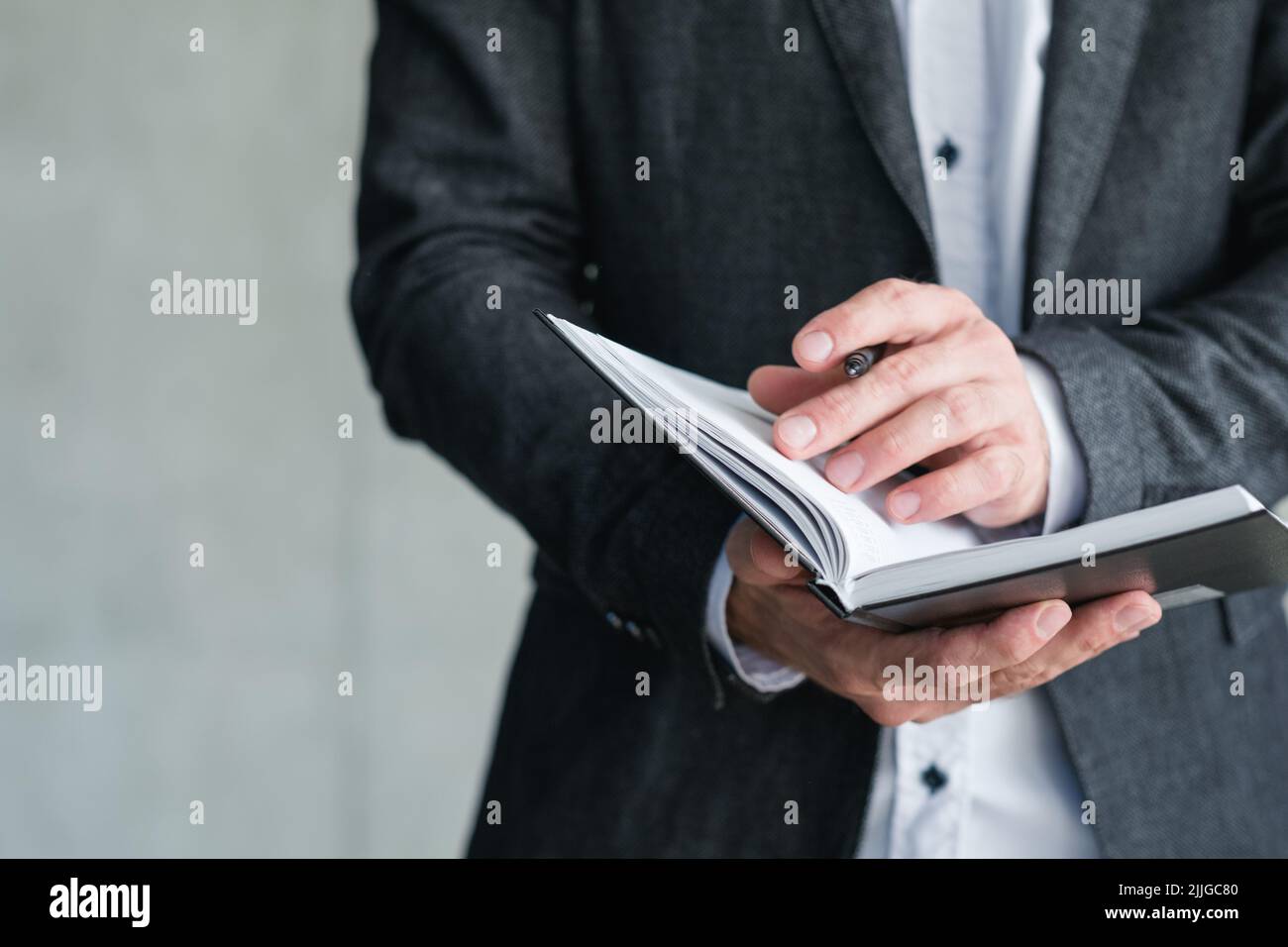 man hold notepad agenda schedule business affair Stock Photo