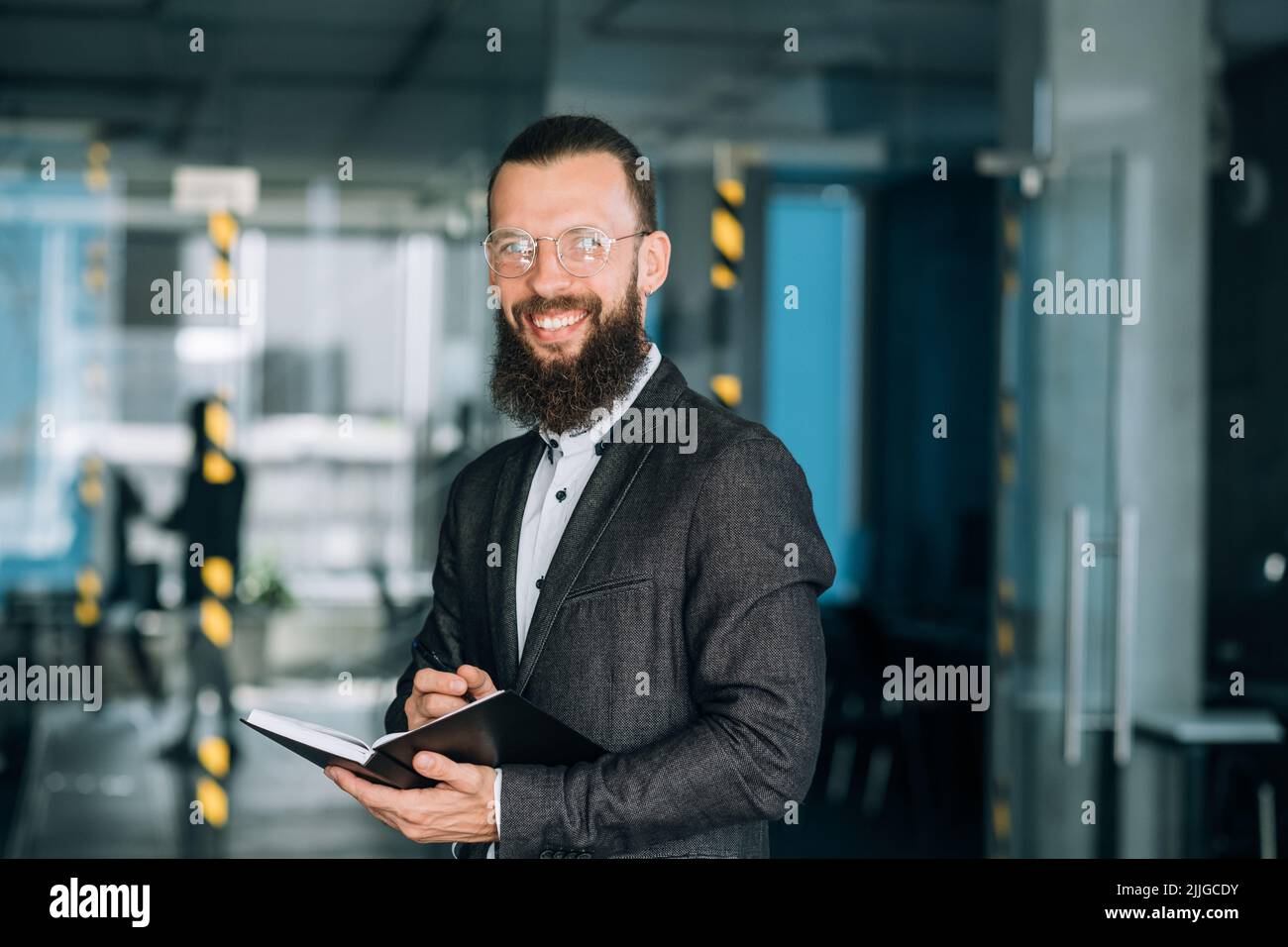 man hold notebook pen business plan strategy Stock Photo