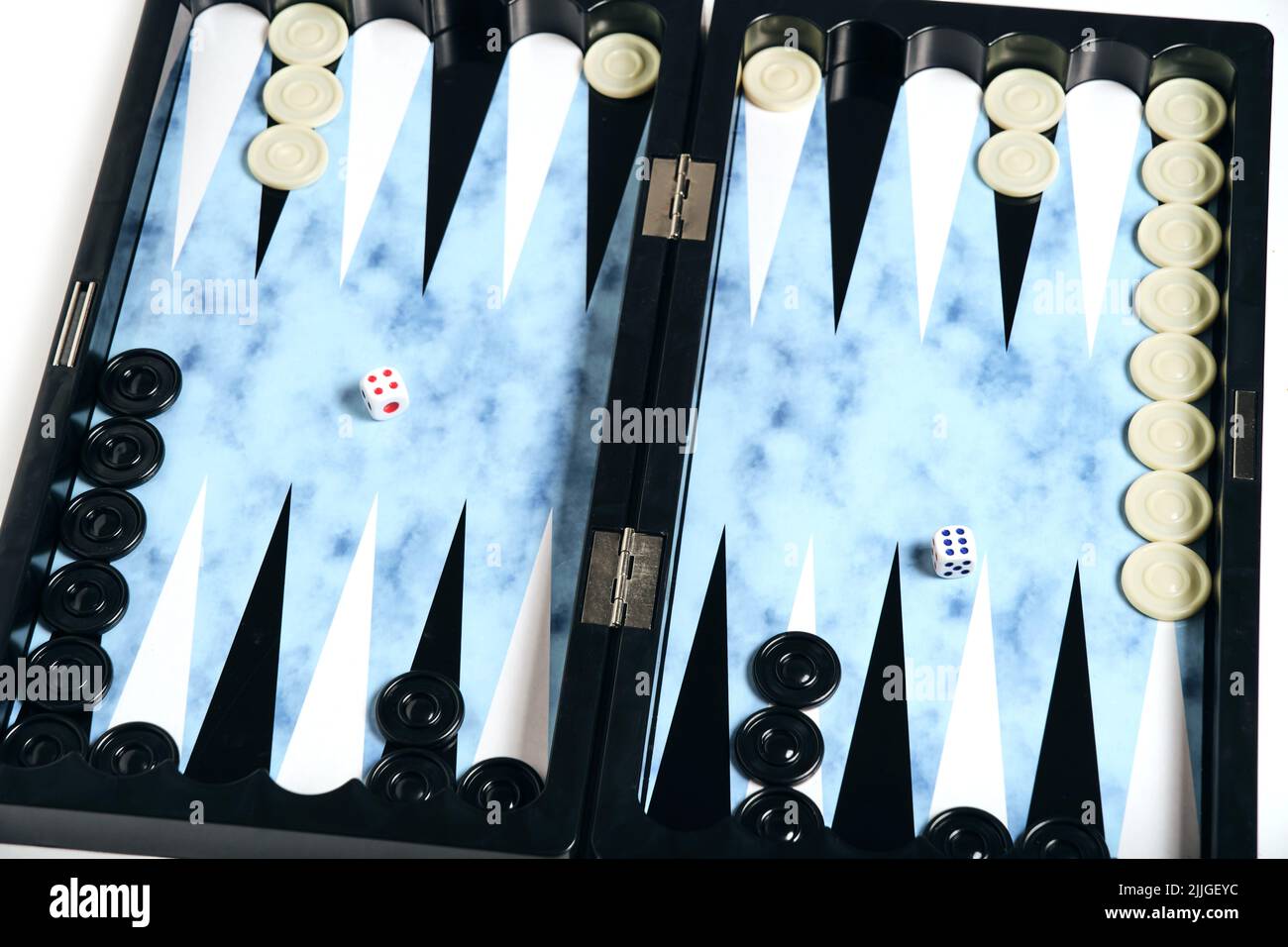 Board with cubes and chips for playing backgammon Stock Photo