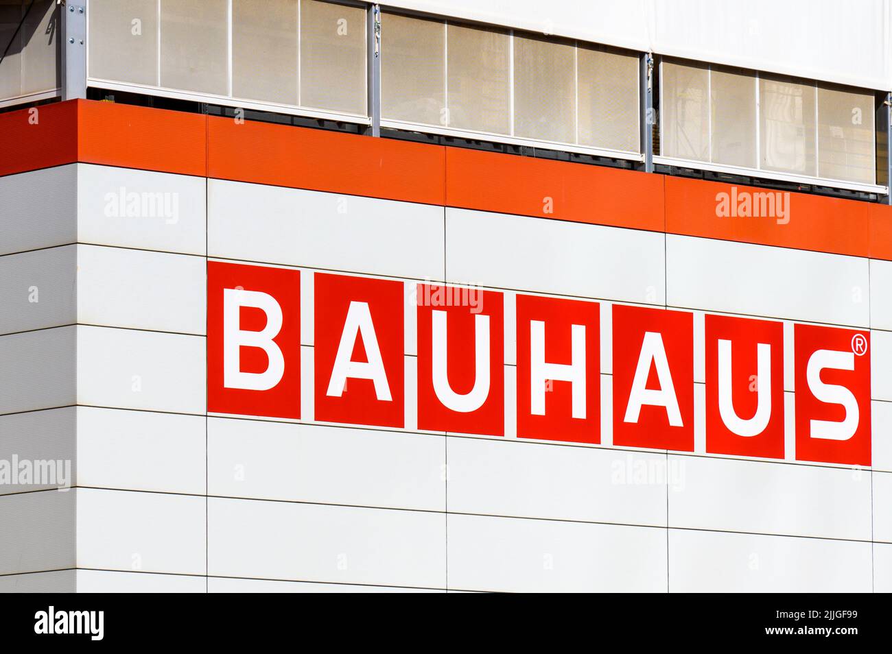Sign or logo of Bauhaus business in the exterior wall of a modern building Stock Photo