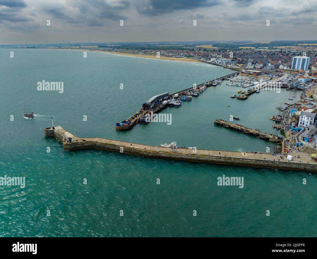 Bridlington Sea Side Sea Front Including Bayside Funfair, Aerial Drone From The Air Birds Eye View Stock Photo