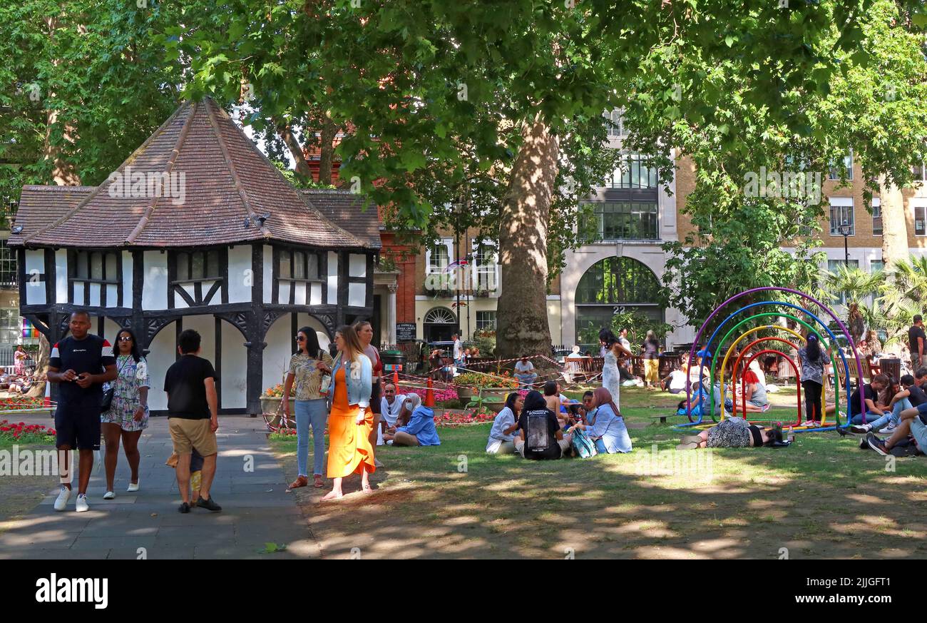Summer crowds in Soho square park , Soho - Entertainment District, London, England, UK, W1D 3QN Stock Photo