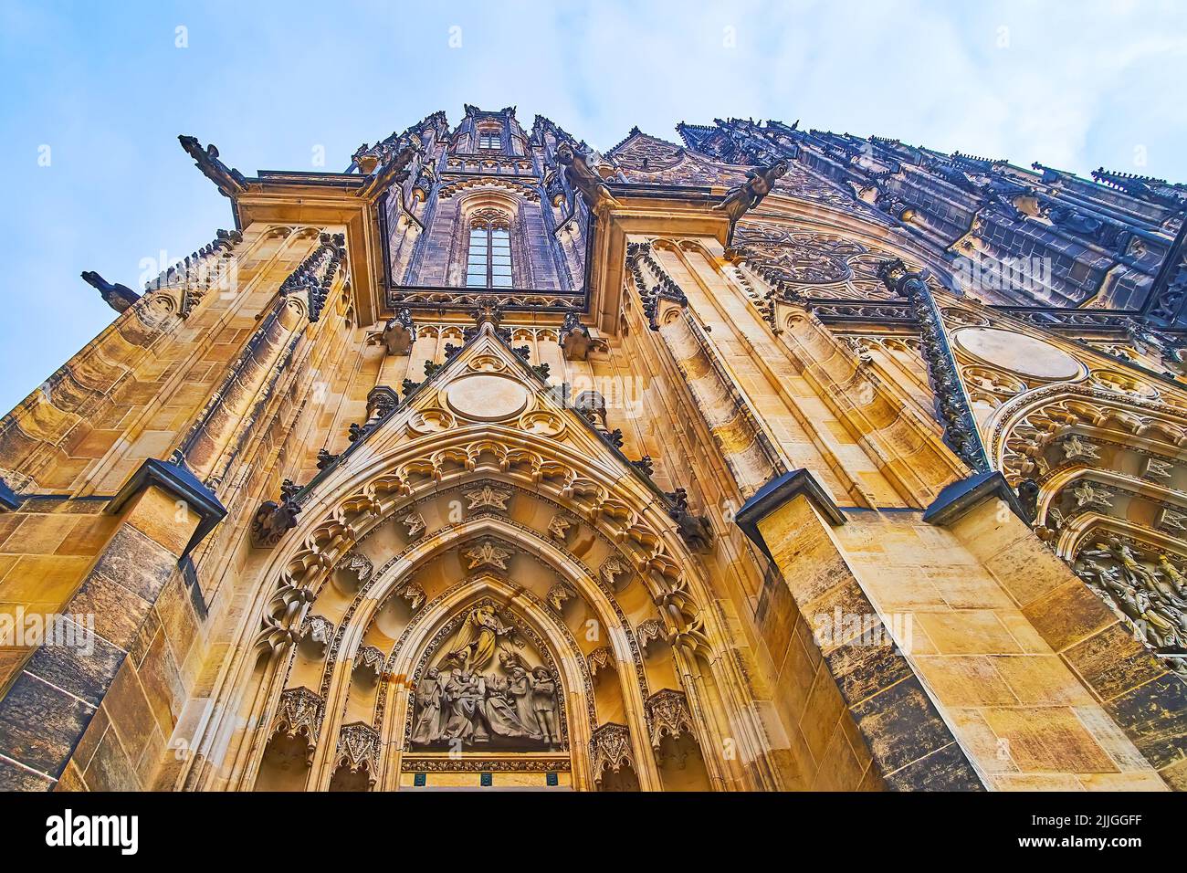 Sandstone outer wall of medieval Gothic St Vitus Cathedral with fine carvings, small wall sculptures, nuemrous decors and gargoyles, Prague, Czech Rep Stock Photo