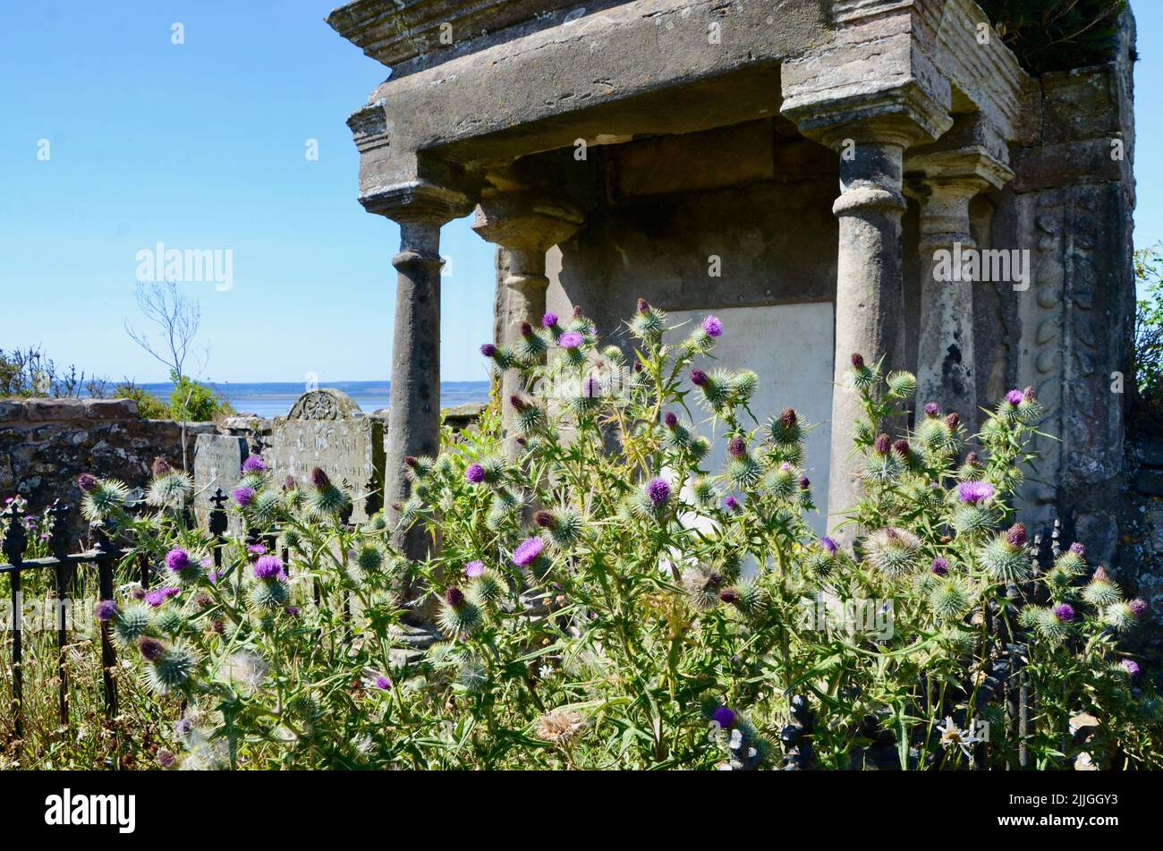 holy island lindisfarne priory castle monastry graveyard boat huts and pilgrims coffee northumberland england great britain 2022 Stock Photo