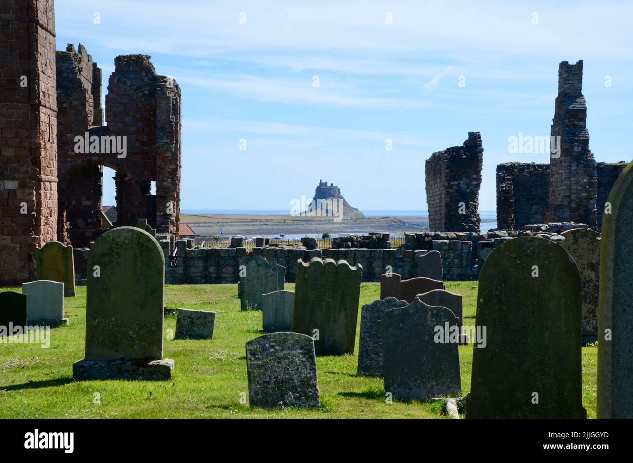 holy island lindisfarne priory castle monastry graveyard boat huts and pilgrims coffee northumberland england great britain 2022 Stock Photo