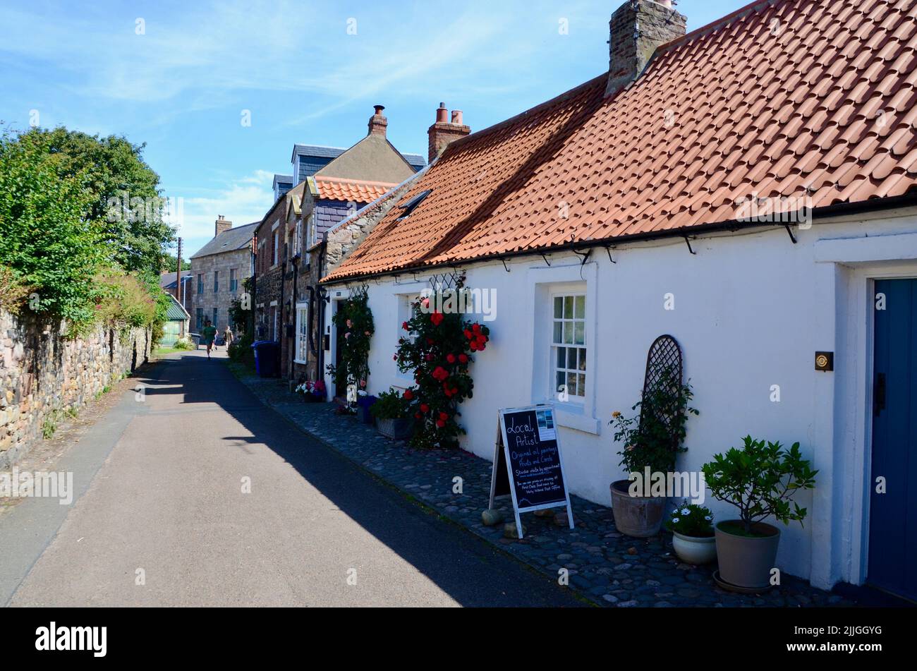 holy island lindisfarne priory castle monastry graveyard boat huts and pilgrims coffee northumberland england great britain 2022 Stock Photo