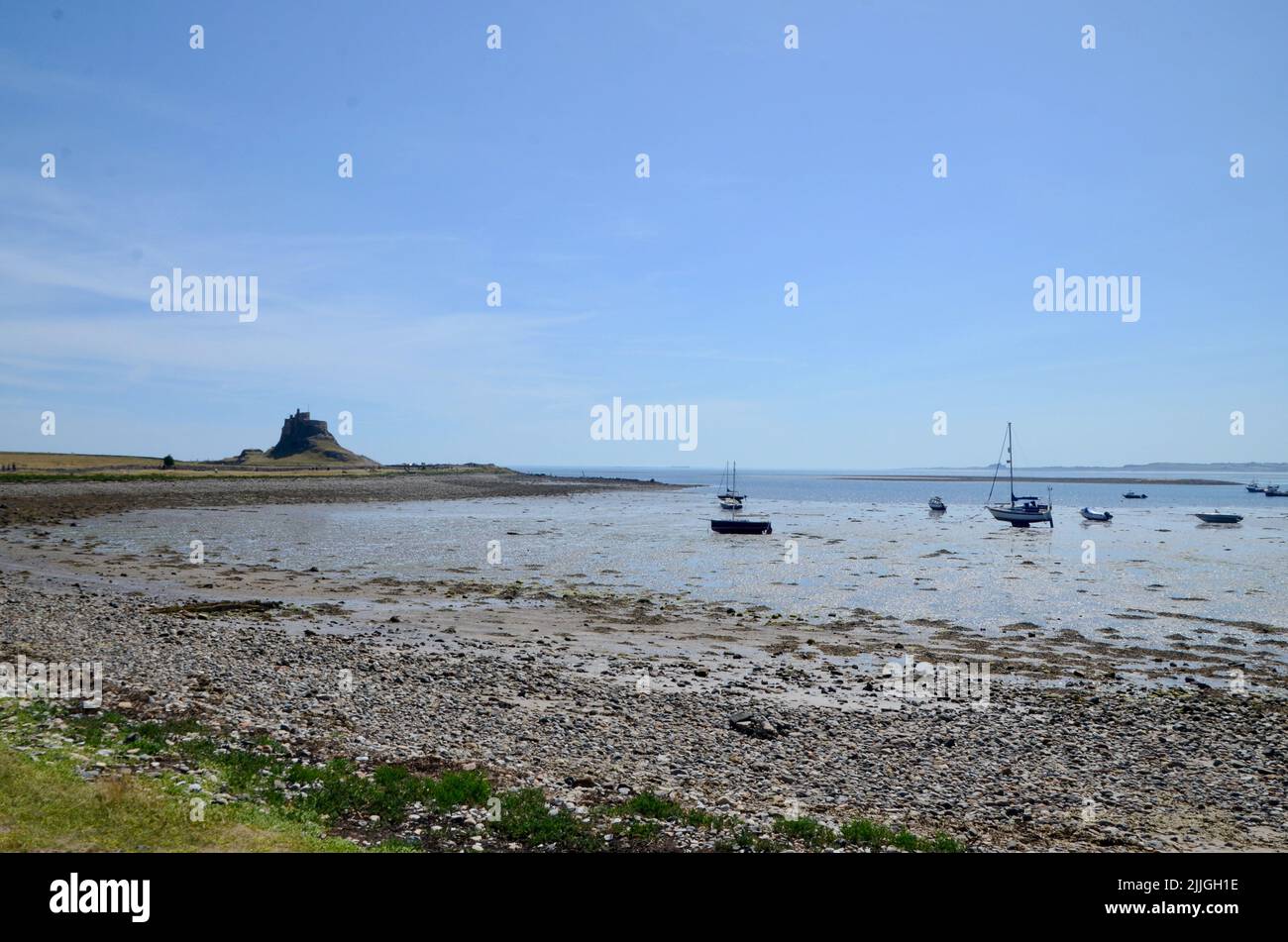 holy island lindisfarne priory castle monastry graveyard boat huts and pilgrims coffee northumberland england great britain 2022 Stock Photo