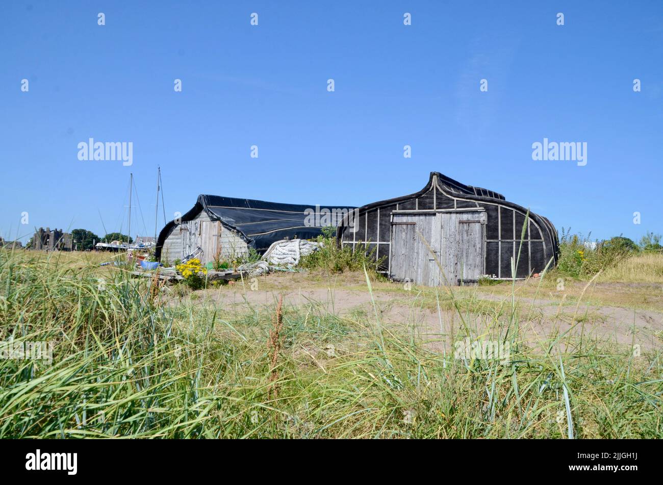 holy island lindisfarne priory castle monastry graveyard boat huts and