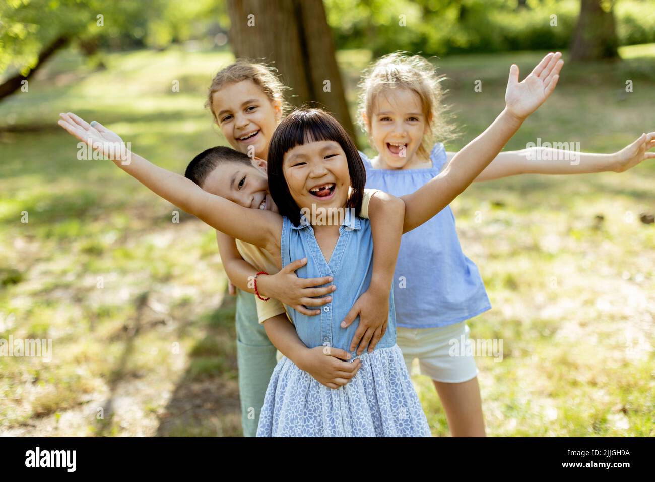 Group of cute asian and caucasian kids having fun in the park Stock ...
