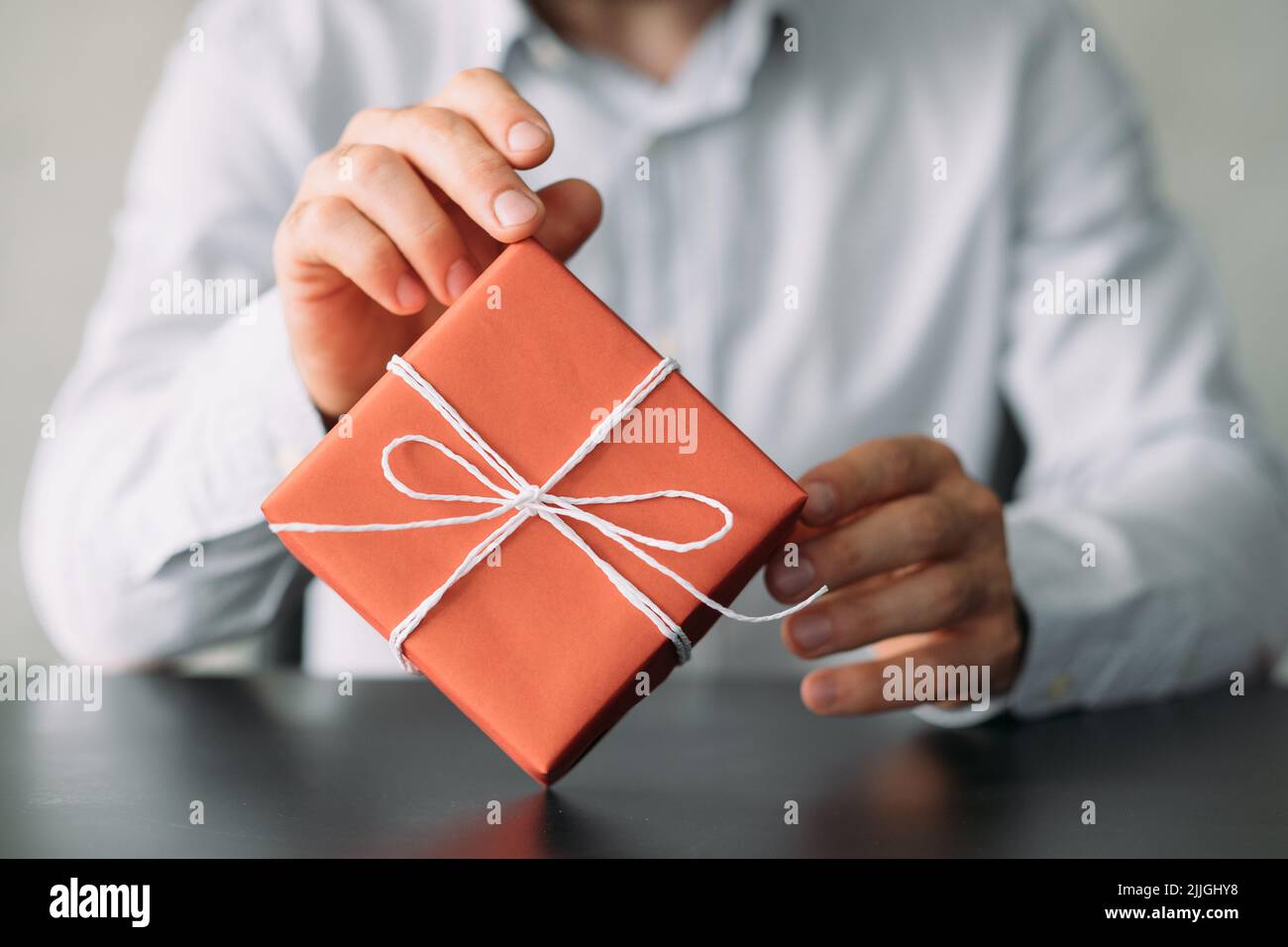 office delivery service business man red gift box Stock Photo Alamy