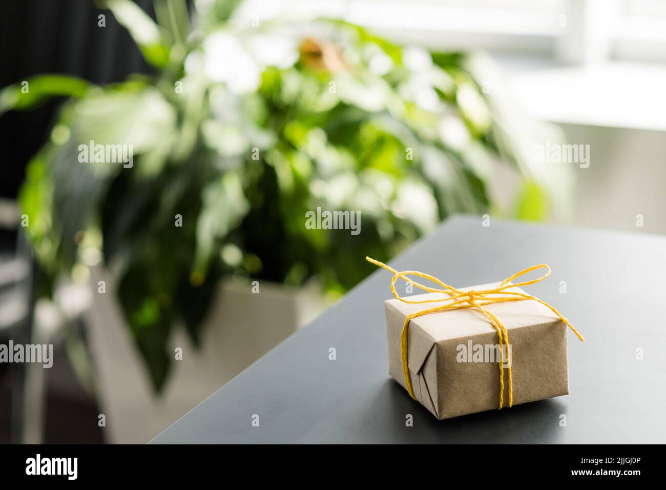 office goods delivery wrapped gift box desk Stock Photo