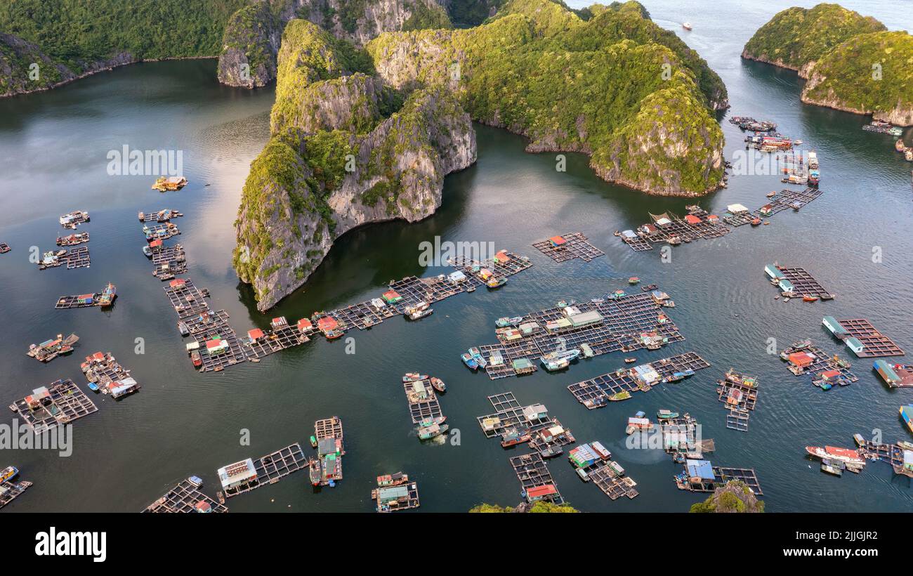 Floating fishing village and rock island in " Lan Ha " Bay, Vietnam, Southeast Asia. UNESCO
