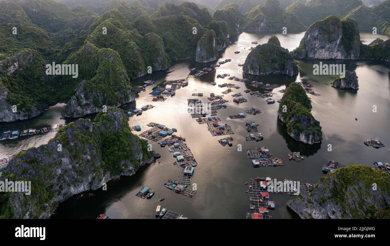 Floating fishing village and rock island in " Lan Ha " Bay, Vietnam