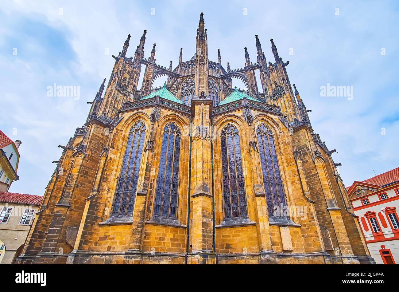 The scenic Gothic sandstone apse of St Vitus Cathedral with tall arched ...