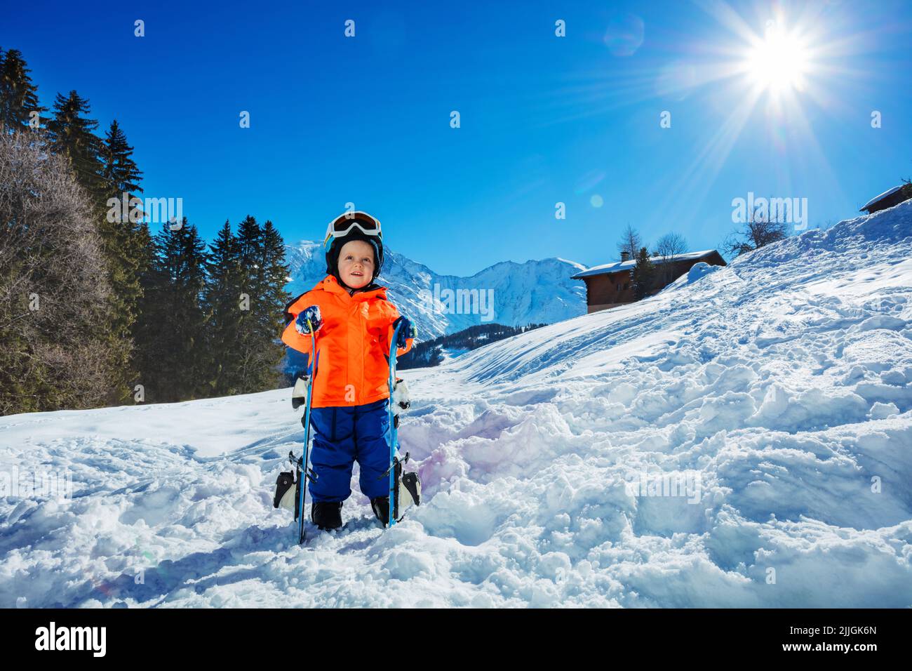 Boy at ski school three years old child in snow over mountains Stock Photo Alamy