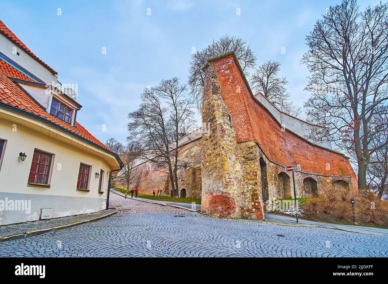 The stone and brick ruins of the medieval rampart of the fortress ...